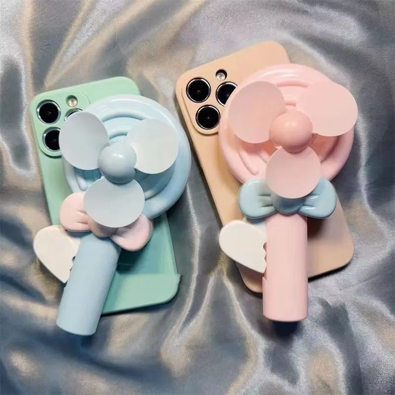 Lollipop hand fan drop-resistant soft TPU phone case in cyan and pink for iPhone models 6 to 15 Pro Max.