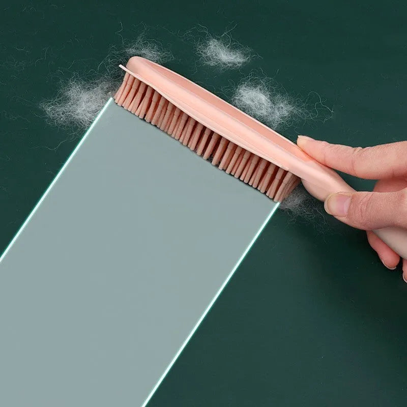 Green dog brush with hair collector reservoir, massage nodules, and a separate pink wool sticker for pet hair removal