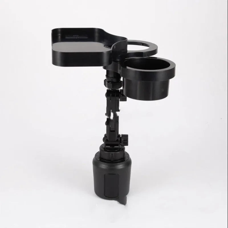 Black car cup holder with wireless charging pad and USB outlet, placed on a vehicle instrument panel.
