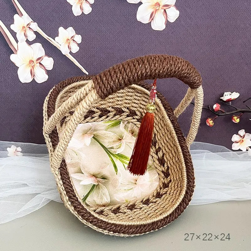 Hand-woven hemp rope basket in natural brown colour measuring 19cm high by 12cm wide