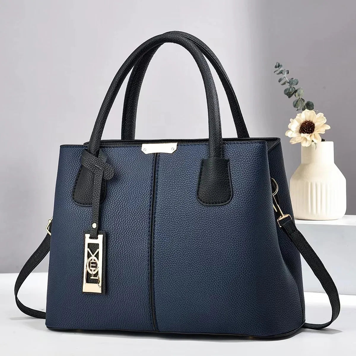 Women's large capacity shoulder bag in soft PU leather with adjustable strap and multiple colour options