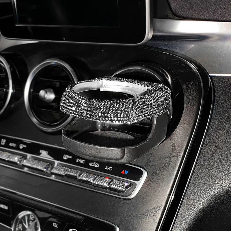 White diamond encrusted ABS plastic car cup holder mounted on a vehicle air vent.