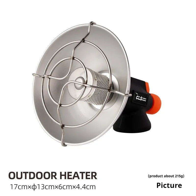 Black and orange portable outdoor heating stove with automatic ignition on a camping table.