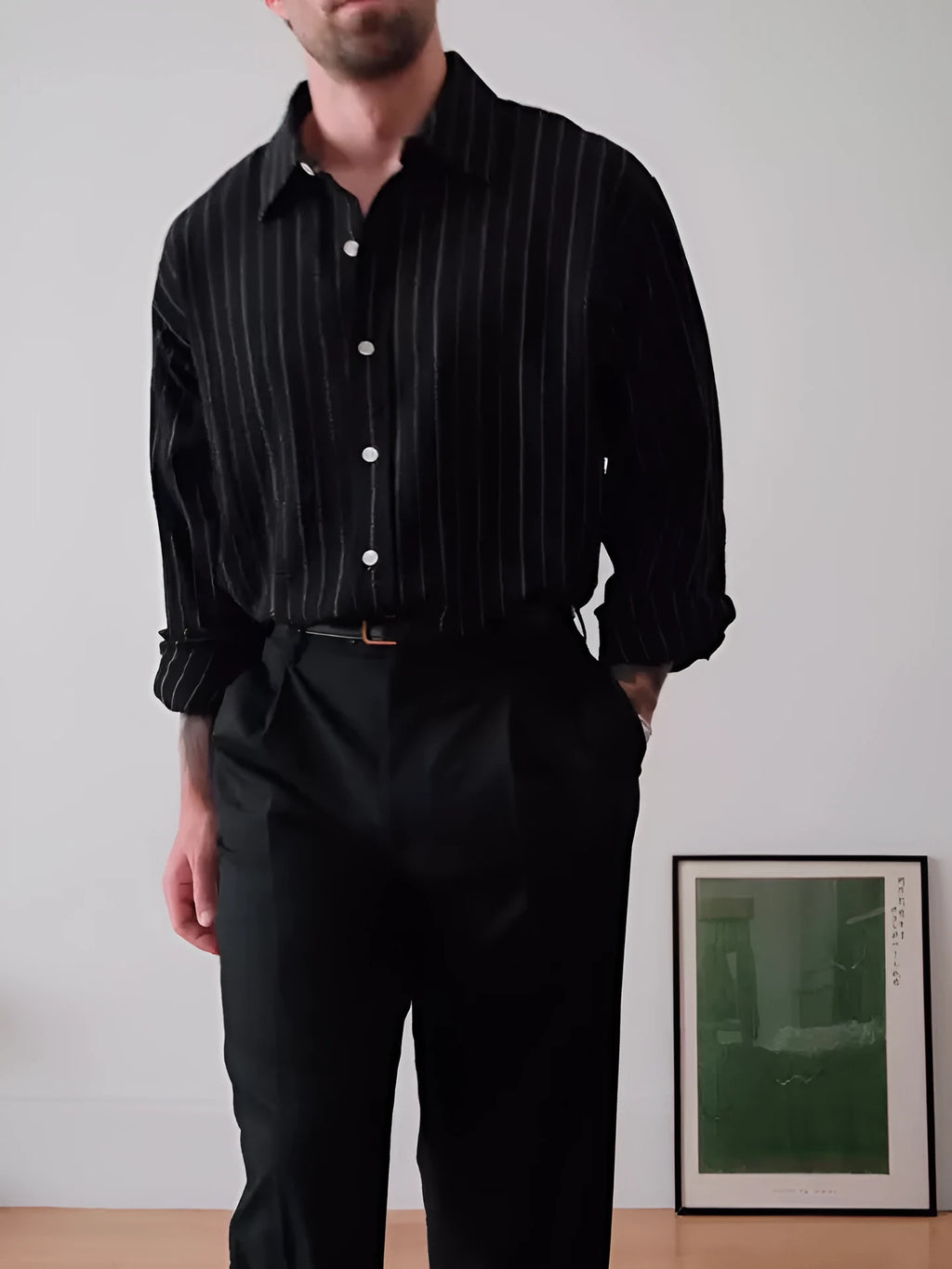Men's black pinstriped button-down shirt showing regular fit and traditional button-down collar