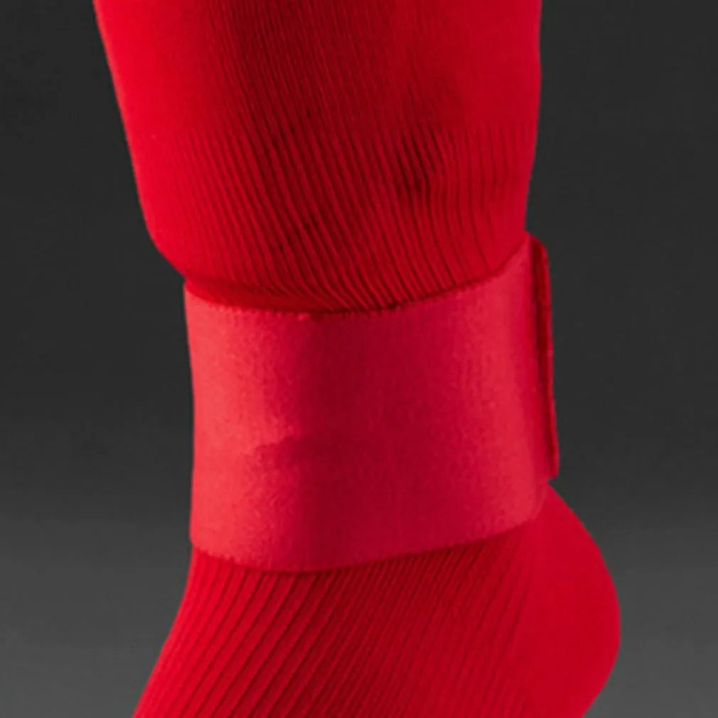 Football shin guard magic tape belt in red, blue, black, or white colours showing rubber strap measuring 25x6.5cm