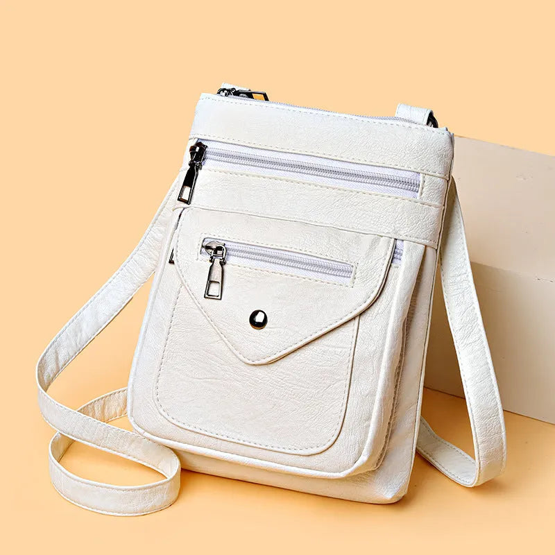 Vertical square crossbody phone shoulder bag in PU with sewing line detail, shown in available colours.