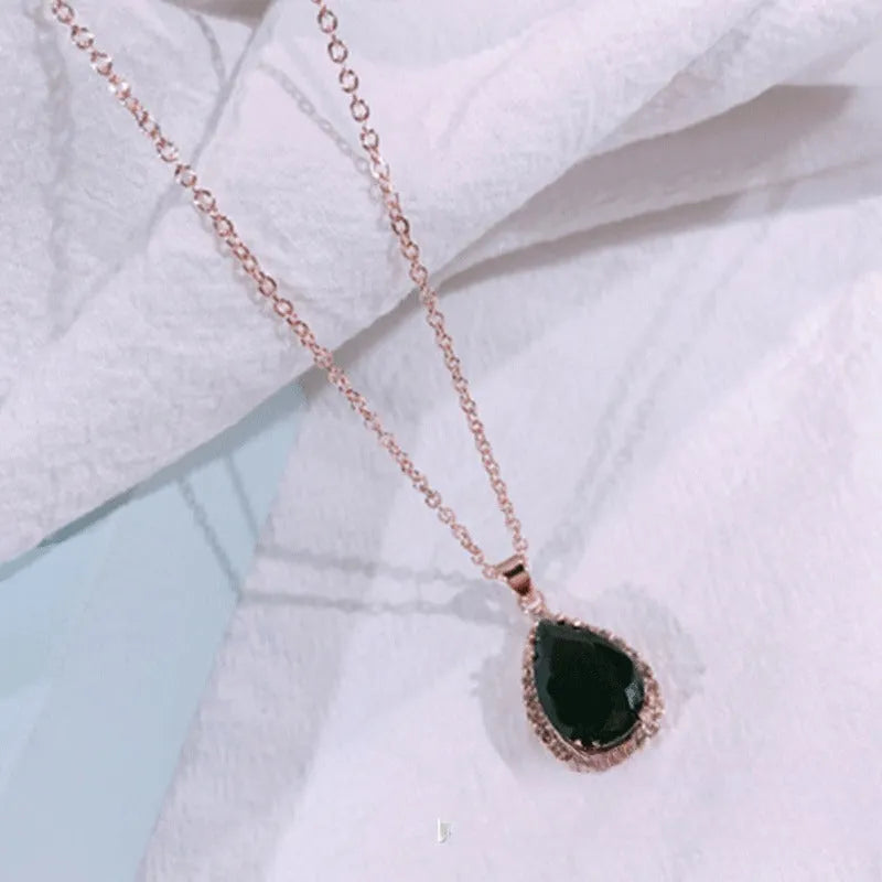 Women's drop-shaped pendant necklace with rhinestone geometric pattern in pink electroplated finish
