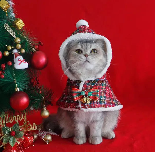 Red polar fleece Christmas cloak with hood for dog or cat wearing antler pattern design.