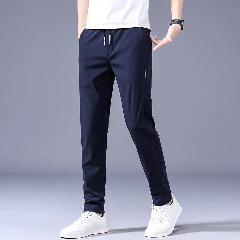 Men's drawstring trousers Korean version loose straight leg sweatpants in khaki colour on model