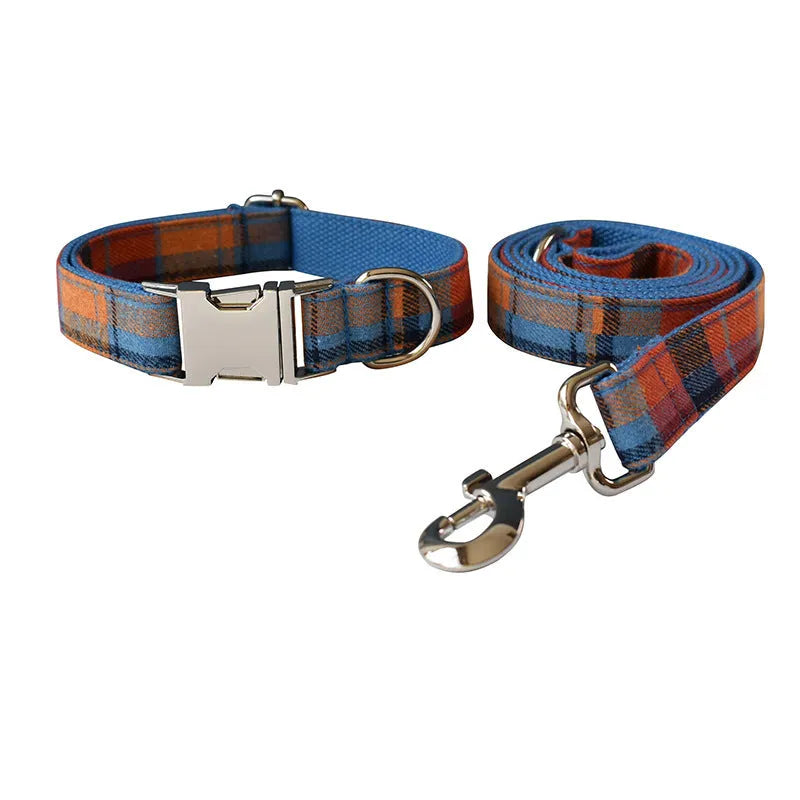 Blue background velvet plaid dog collar with a silver alloy buckle on a size tag.