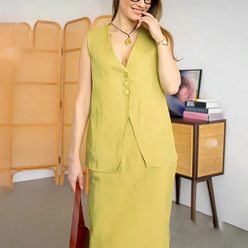 Women's white casual two-piece suit comprising a sleeveless vest and a long skirt on a hanger.