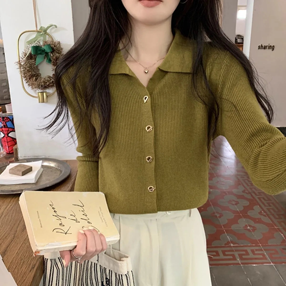 Loose fit long sleeve viscose knitted cardigan in beige, shown worn open.