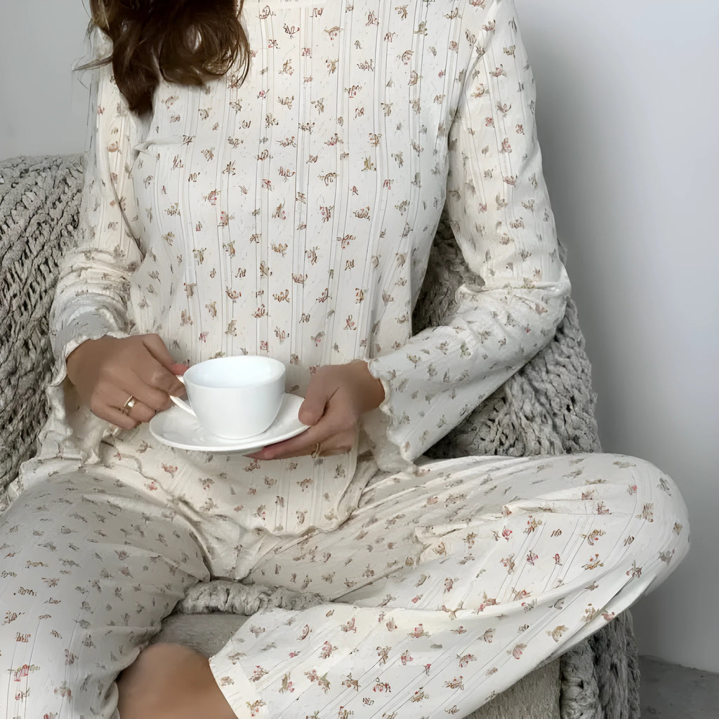 Women's white floral print bell sleeve round neck top and wide leg pants loungewear suit on model
