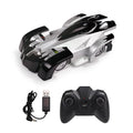 Wall climbing RC car in black with LED lights and 360-degree rotation on a wall surface