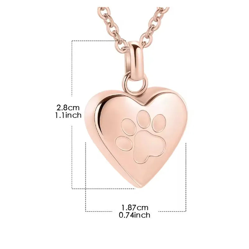 Silver heart pendant necklace with paw print design that opens as a casket.