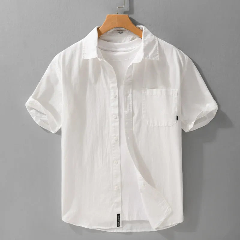 Men's loose-fit pure cotton short sleeve shirt in light blue, showing casual cardigan style.