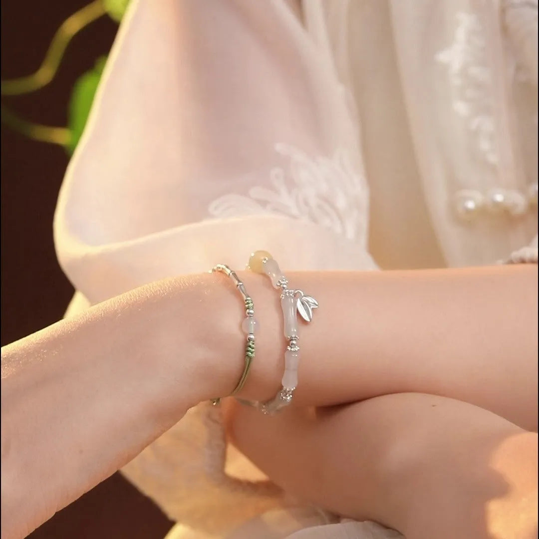 Natural Tianshan green bamboo and sterling silver antique-style bracelet for women with a bamboo joint motif.
