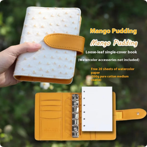A7 size loose-leaf watercolour sketchbook in avocado green, showing miniature dimensions and removable pages.