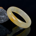 Natural light jade bracelet in traditional Chinese style with polished surface
