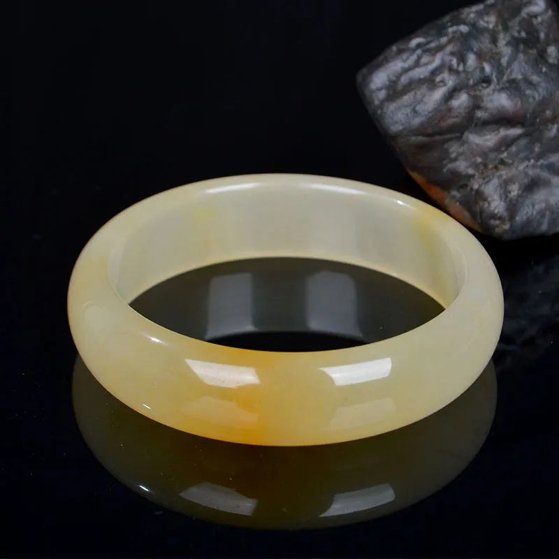 Natural light jade bracelet in traditional Chinese style with polished surface
