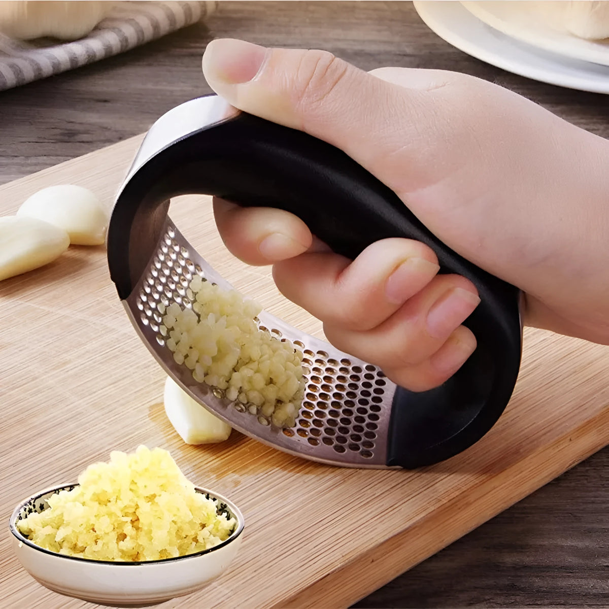 Stainless steel garlic masher press with ergonomic handle and non-slip grip