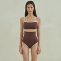 Brown triangle one-piece swimsuit for women on a mannequin.