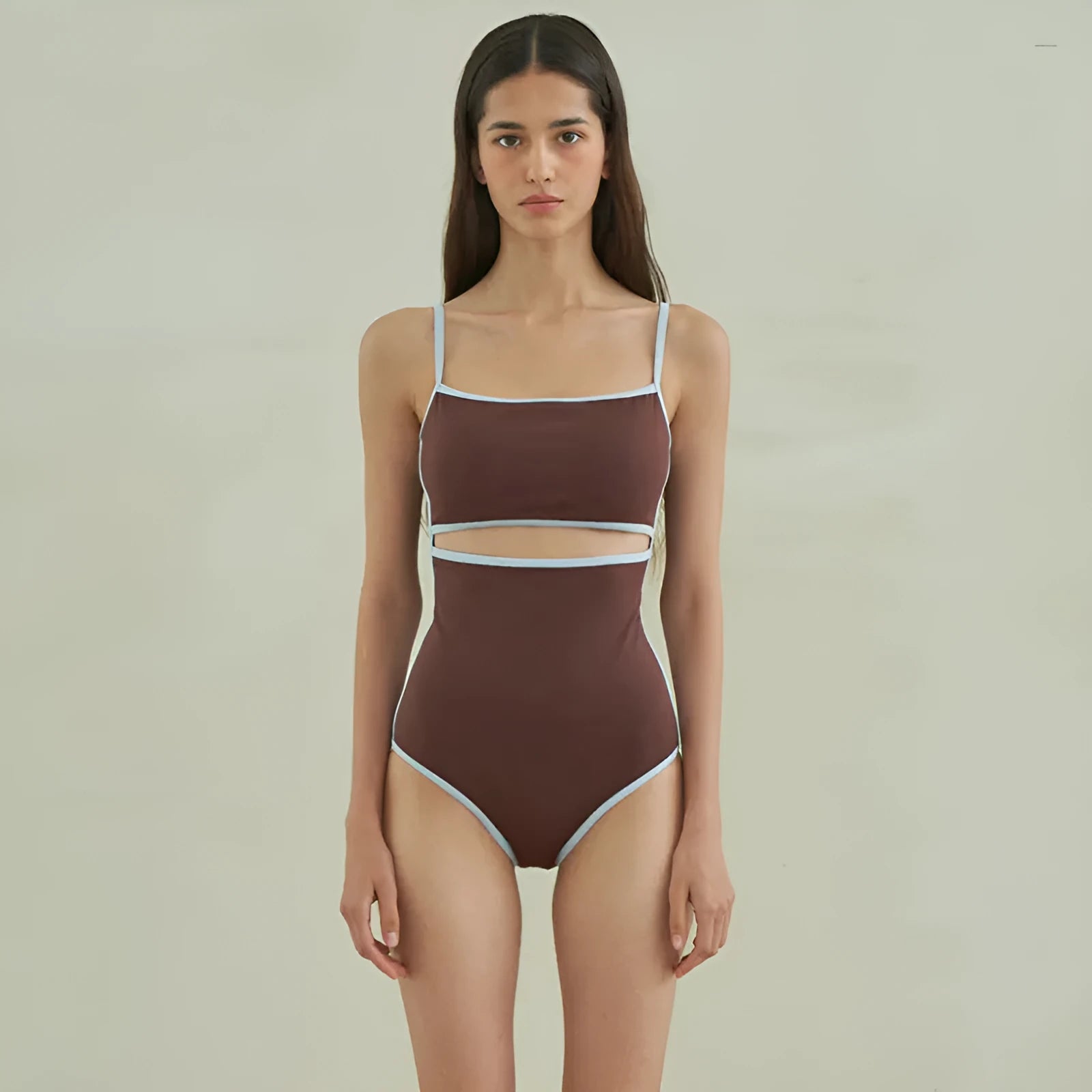 Brown triangle one-piece swimsuit for women on a mannequin.