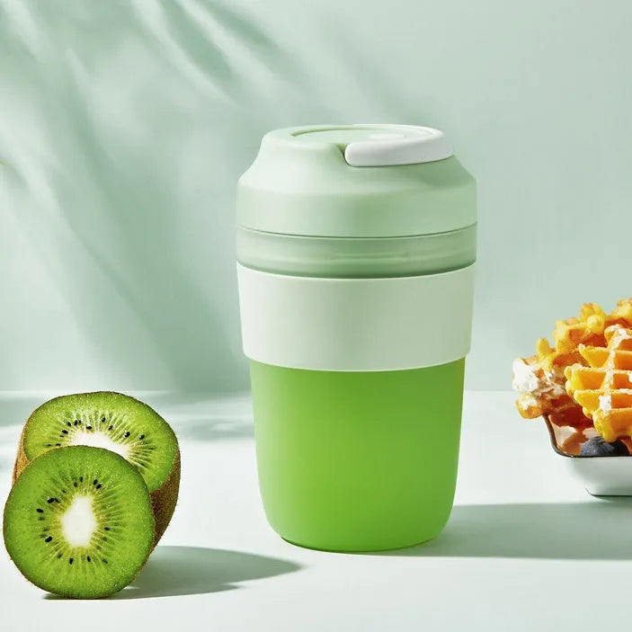 Grape purple portable rechargeable blender juicer cup with 400ml capacity and four stainless steel blades.