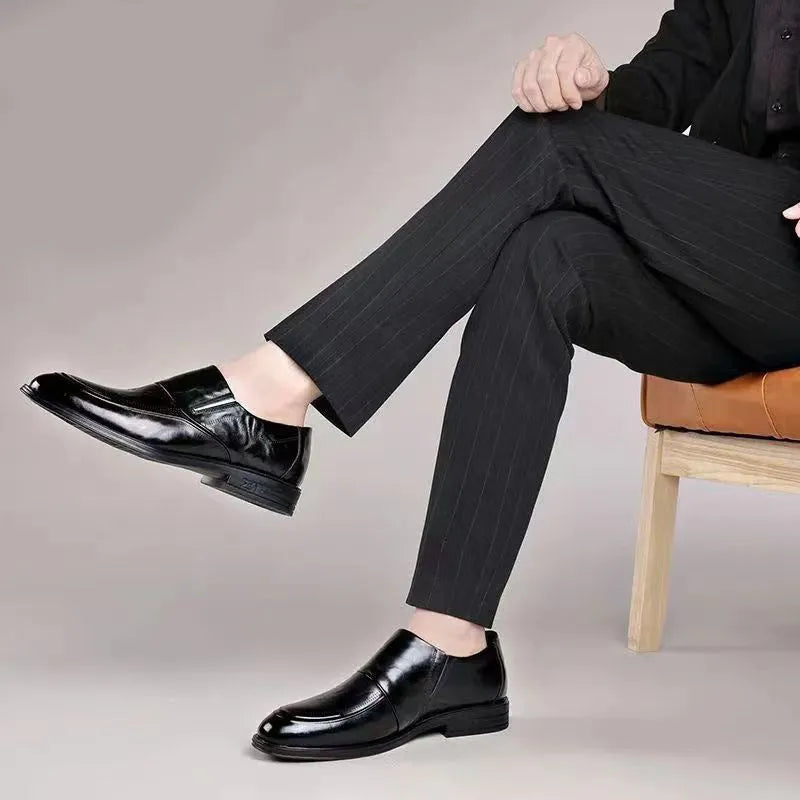 Men's black PU pointed toe slip-on formal shoes with rubber sole and metal detailing on a white background