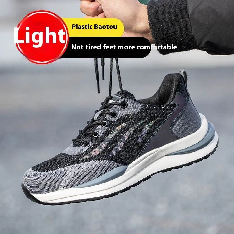 Men's black and grey low-top safety shoes with plastic toe cap, lace-up front, and textured PU sole.