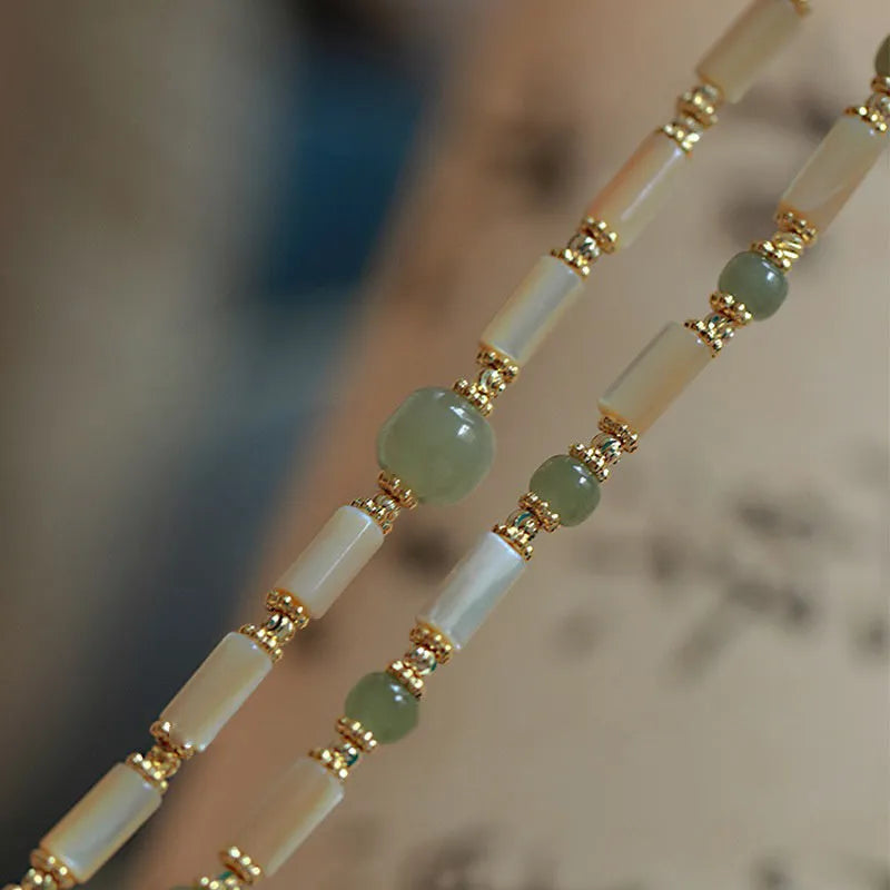 Women's Hetian jade bracelet with white round beads in simple geometric design