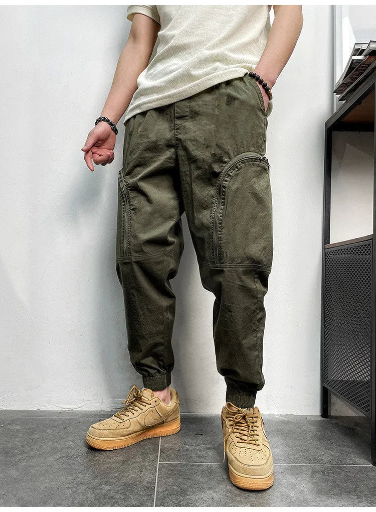 Men's loose fit cotton cargo trousers with elastic waist and zipper pockets in army green