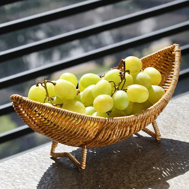 Plastic knitted basket fruit dim sum rack on a desktop with melon seeds and snacks