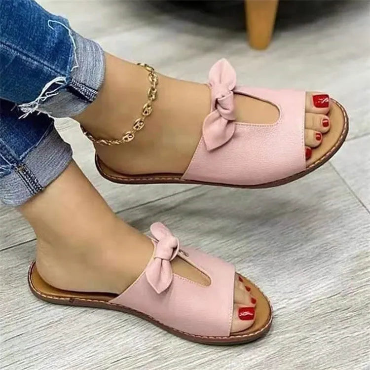 Ladies fish mouth sandals with a bow decoration in black, pink, or gold colours