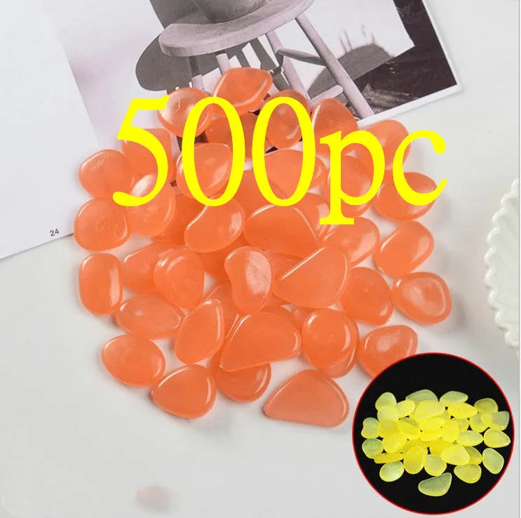 Luminous fluorescent aquarium and garden pebbles in mixed colours including dark purple, yellow, light blue, pink, orange