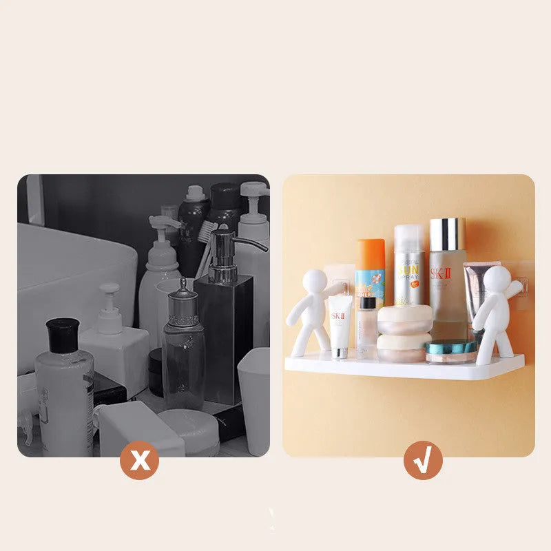 White plastic wall-mounted storage shelf in little man doll design on a bathroom wall