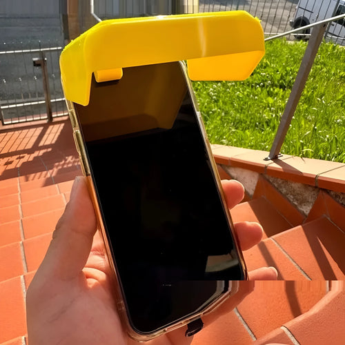 Yellow and black plastic beach phone sunshade holder with a clip for outdoor use.