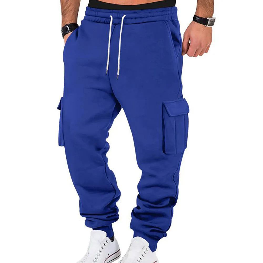 Men's solid colour casual multi-pocket drawstring sports pants in black, featuring polyester fabric and mid-waist design