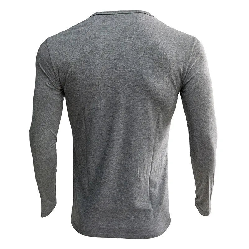 Men's solid blue long sleeved cotton blend t-shirt with a Henry neck, laid flat.