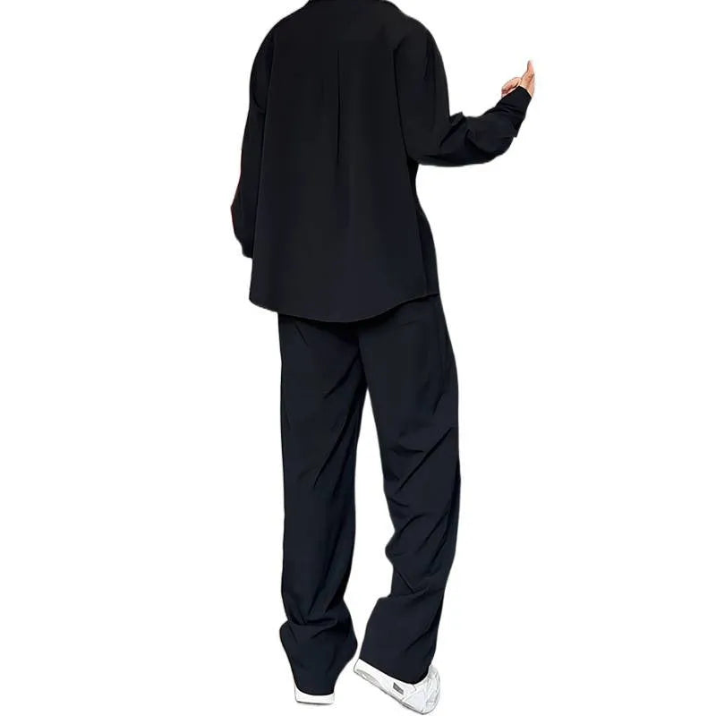 Men's black casual two-piece suit with long sleeve polo shirt and matching trousers in slim fit design