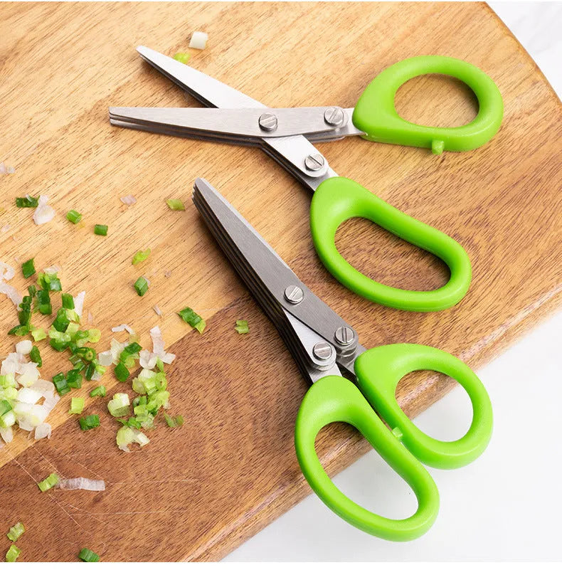Green stainless steel multi-blade herb scissors with V-shaped design for cutting nori and green onions.