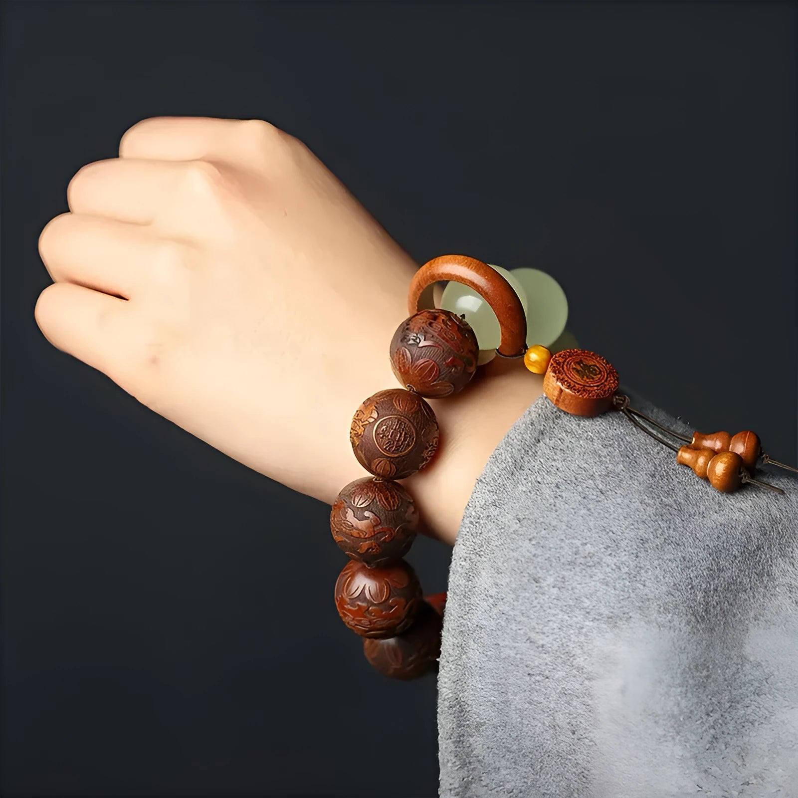 Wooden Fu character bracelet with twelve 20mm rosewood beads on flexible rings