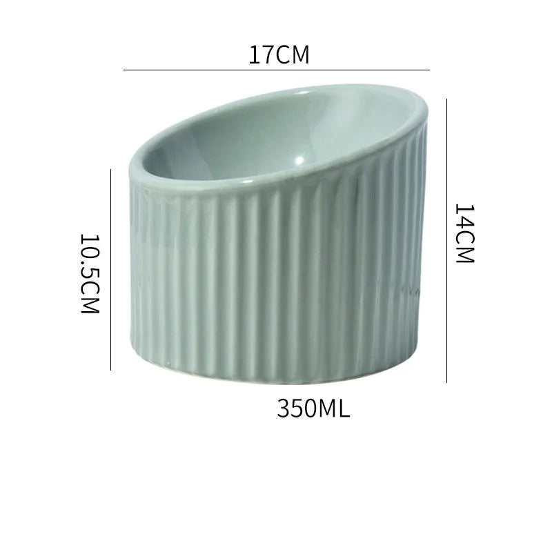 Ceramic elevated cat bowl in green colour with tilted round design for comfortable feeding.