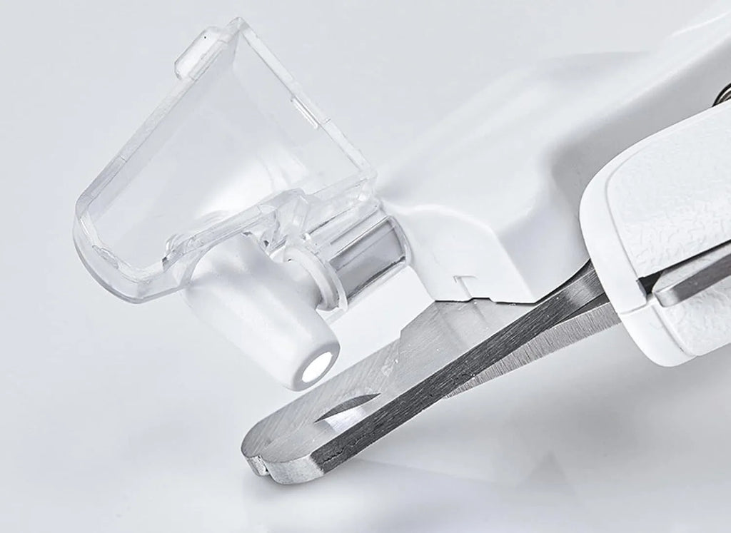 White LED pet nail clipper for cats and dogs with transparent anti-splash guard and file.