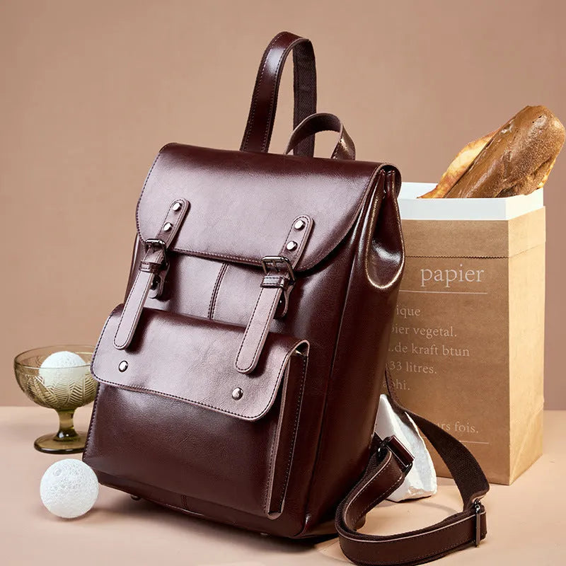 Genuine two-layer cowhide leather computer backpack for women in black, brown, or coffee.