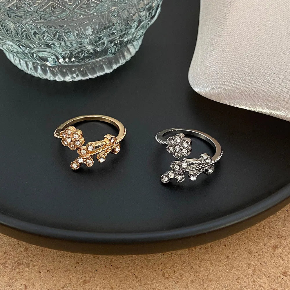 Gold diamond treated copper open ring with flower and leaf design for women
