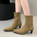 Brown square toe ankle boots with side zipper and kitten heels on a waterproof platform sole