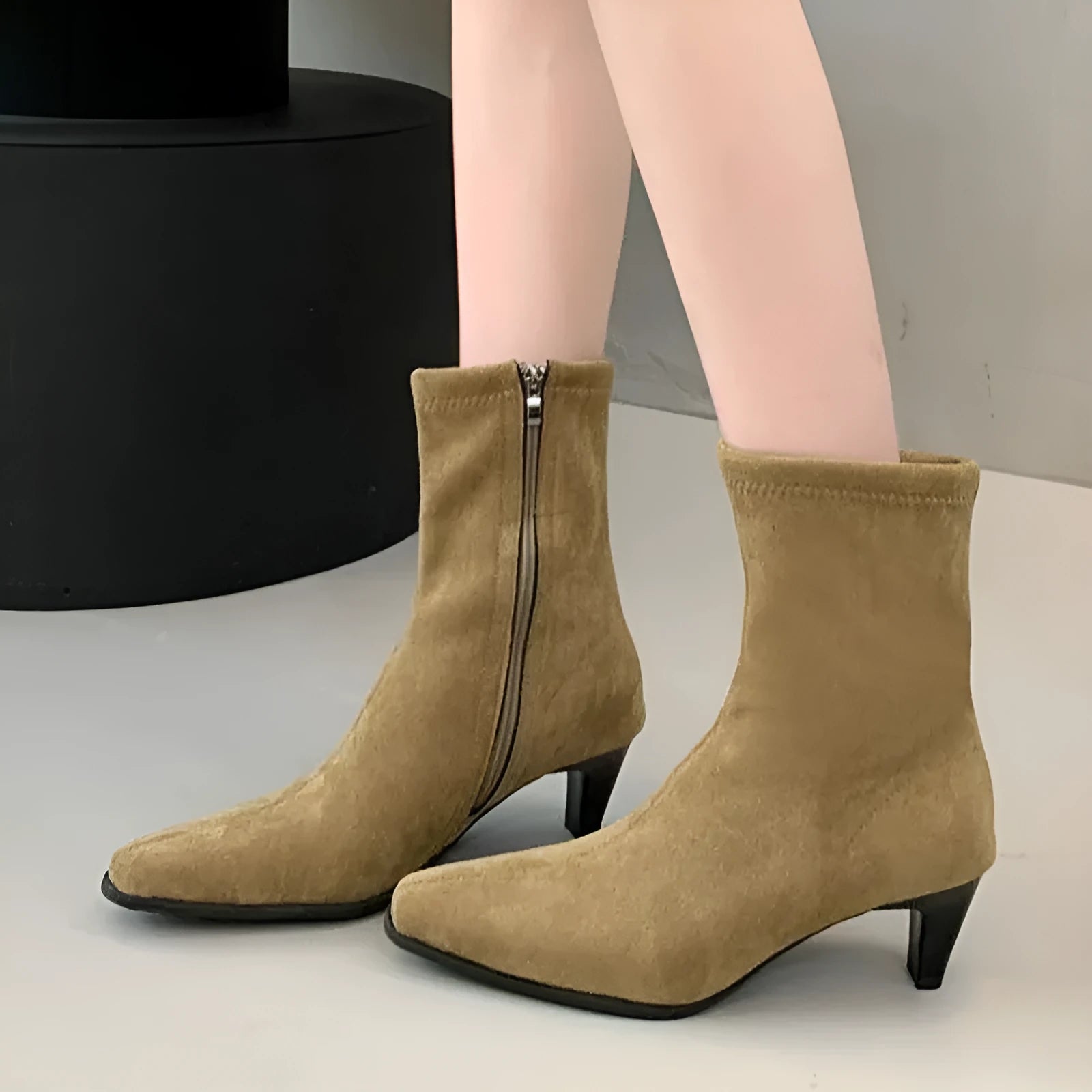 Brown square toe ankle boots with side zipper and kitten heels on a waterproof platform sole