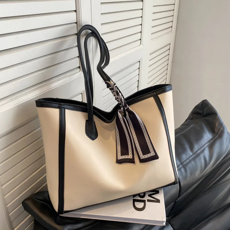 Soft PU commuter shoulder bag showing open pocket, internal phone compartment, and zippered change section