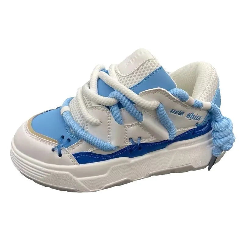 Grey women's retro clunky sneakers with thick rubber sole and lace-up front.